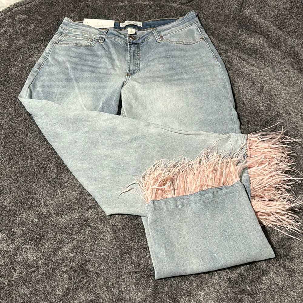 Super cute Jeans with Pink Feathers around the bottom of the legs. Size 14!